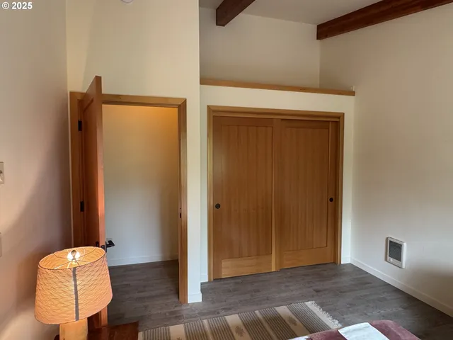 a view of room with wooden floor and chair