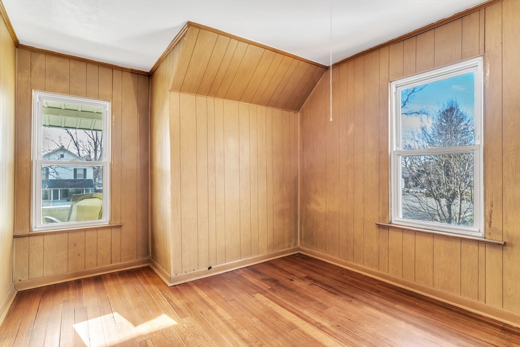 164 Phoenix Terrace Springfield, MA 01104 - Photo 23 of 39 wooden floor in an empty room with a window