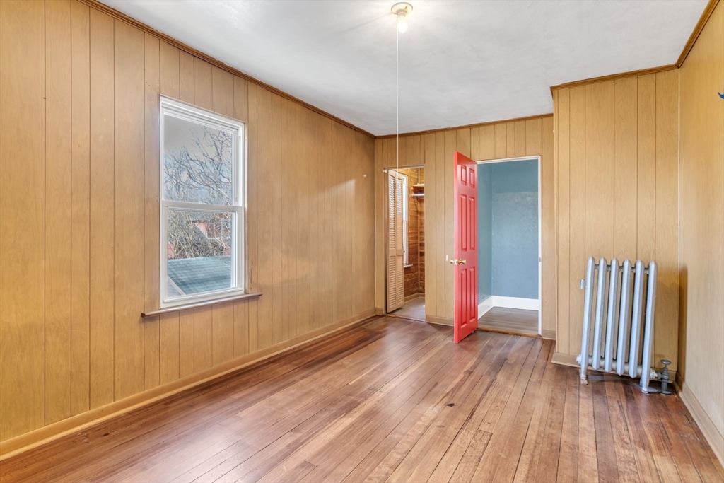 164 Phoenix Terrace Springfield, MA 01104 - Photo 25 of 39 a view of an empty room with wooden floor and a window