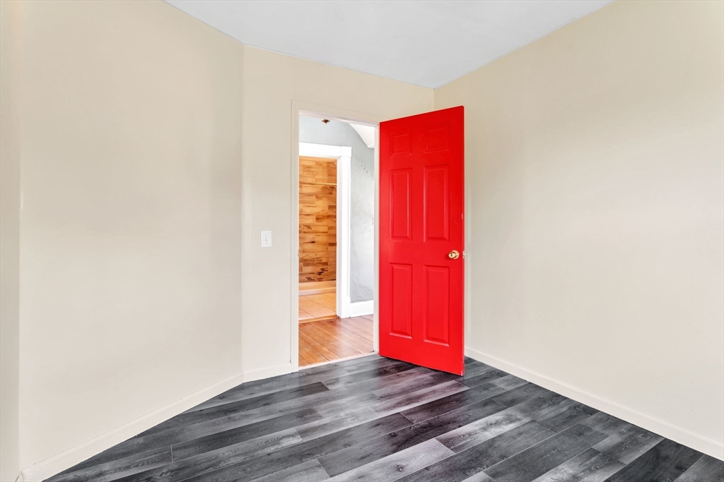 164 Phoenix Terrace Springfield, MA 01104 - Photo 27 of 39 a view of a room with wooden floor and windows