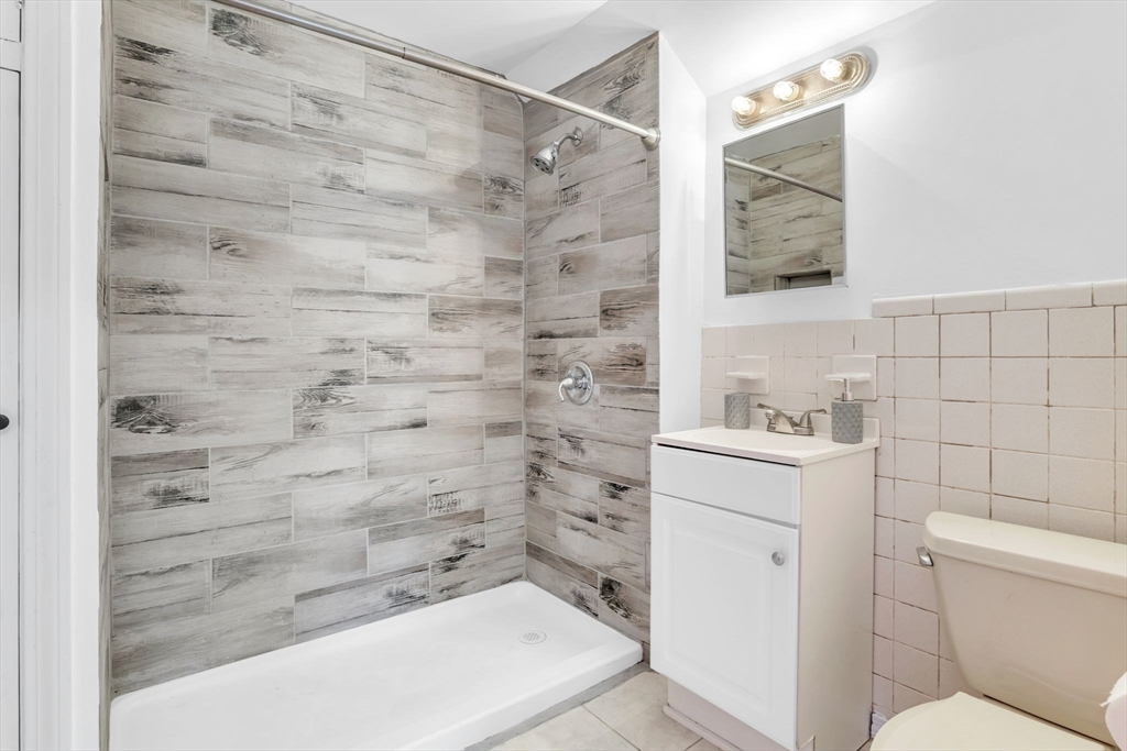 164 Phoenix Terrace Springfield, MA 01104 - Photo 29 of 39 a bathroom with a shower toilet and sink