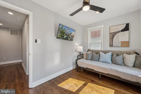 a living room with a couch and a window