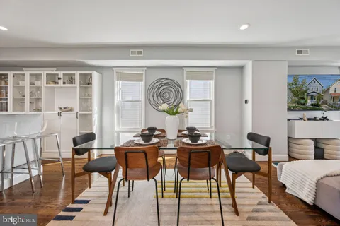a view of a dining room with furniture and window