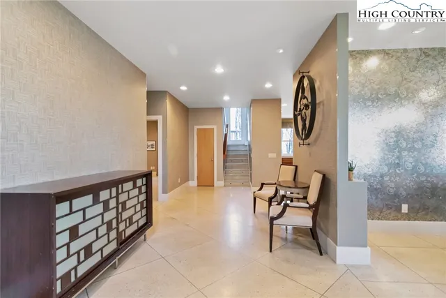 a view of a hallway with seating area