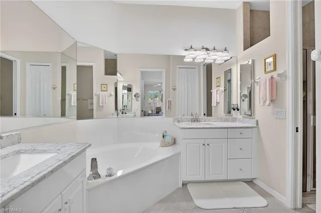 a view of a dining room kitchen with furniture and a chandelier