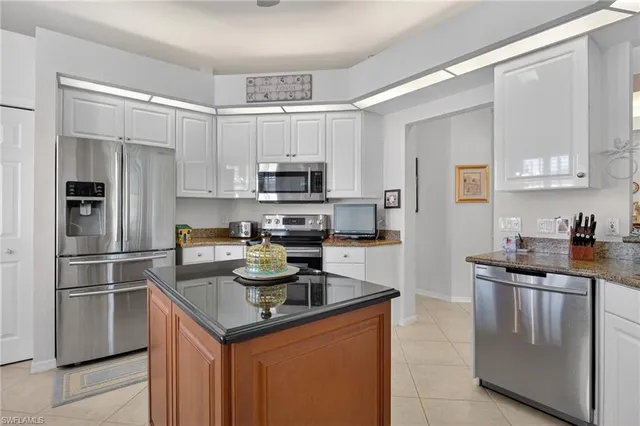 a view of a dining room with furniture and windows