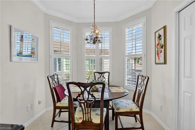 a living room with fireplace furniture and a large window
