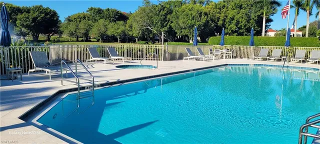 an aerial view of a house with a yard and garden