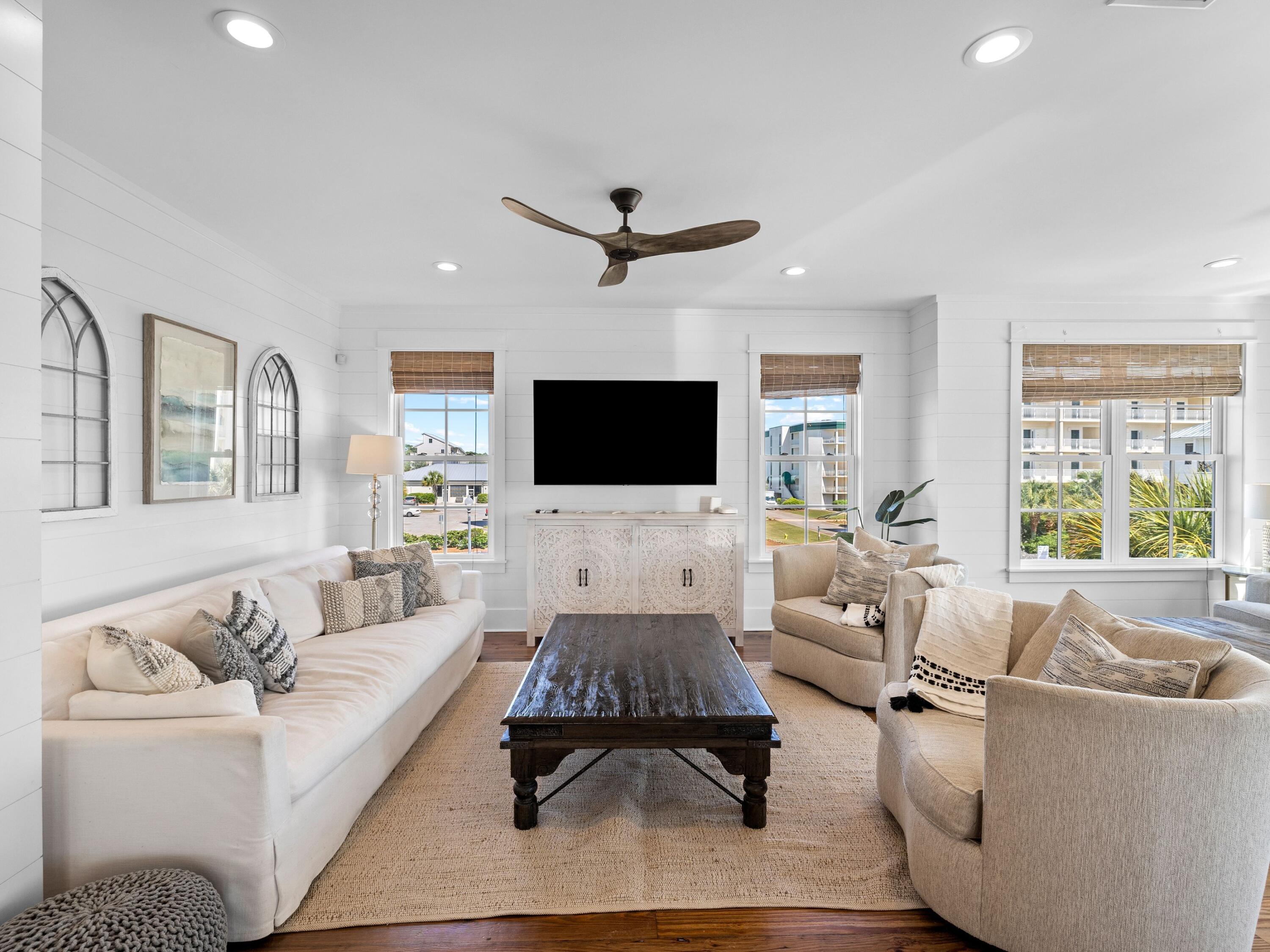 113 Dunes Estates Boulevard Santa Rosa Beach, FL 32459 - Photo 13 of 35 a living room with furniture flat screen tv and a large window