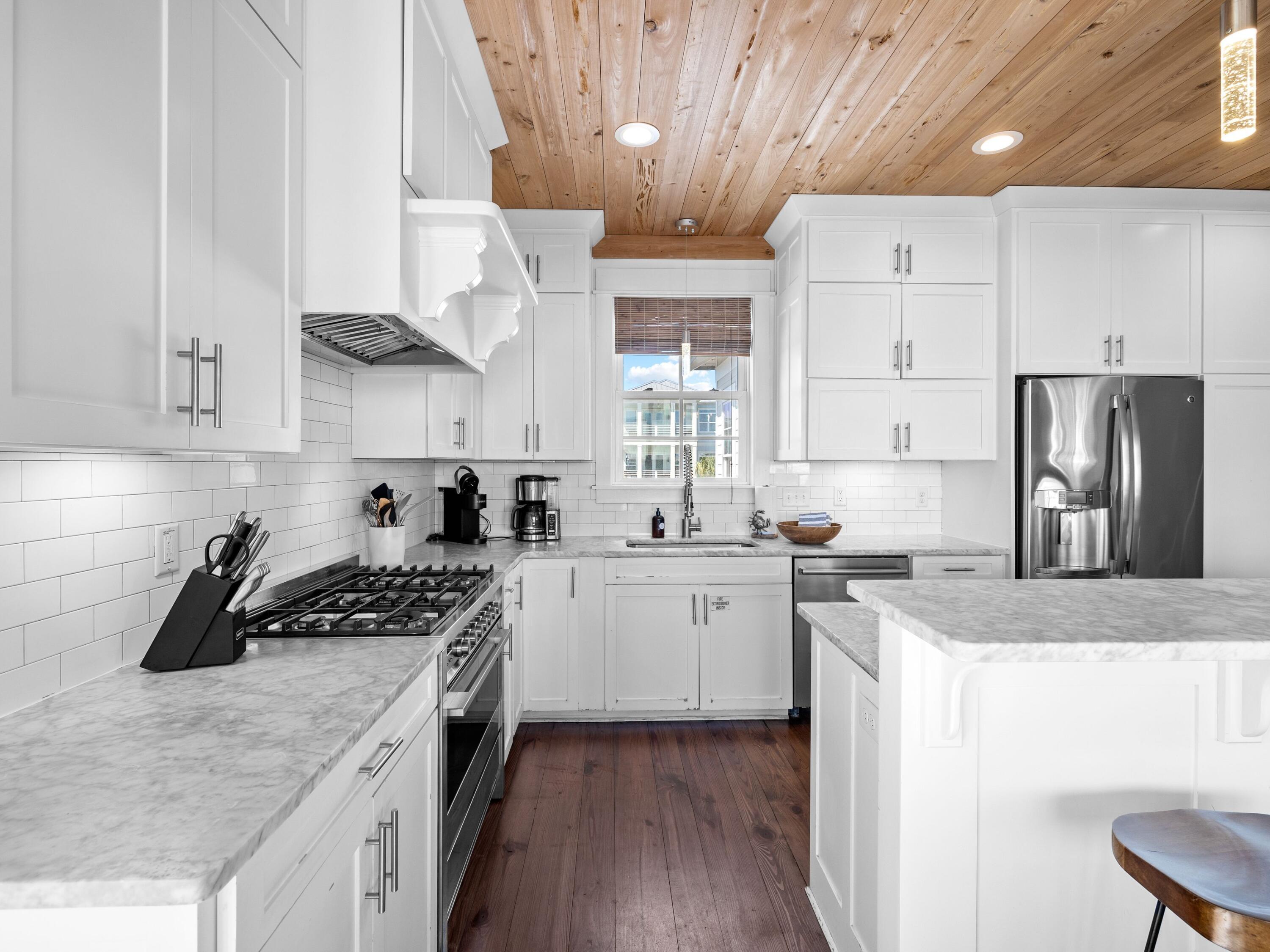 113 Dunes Estates Boulevard Santa Rosa Beach, FL 32459 - Photo 15 of 35 a kitchen with stainless steel appliances granite countertop a sink stove and refrigerator