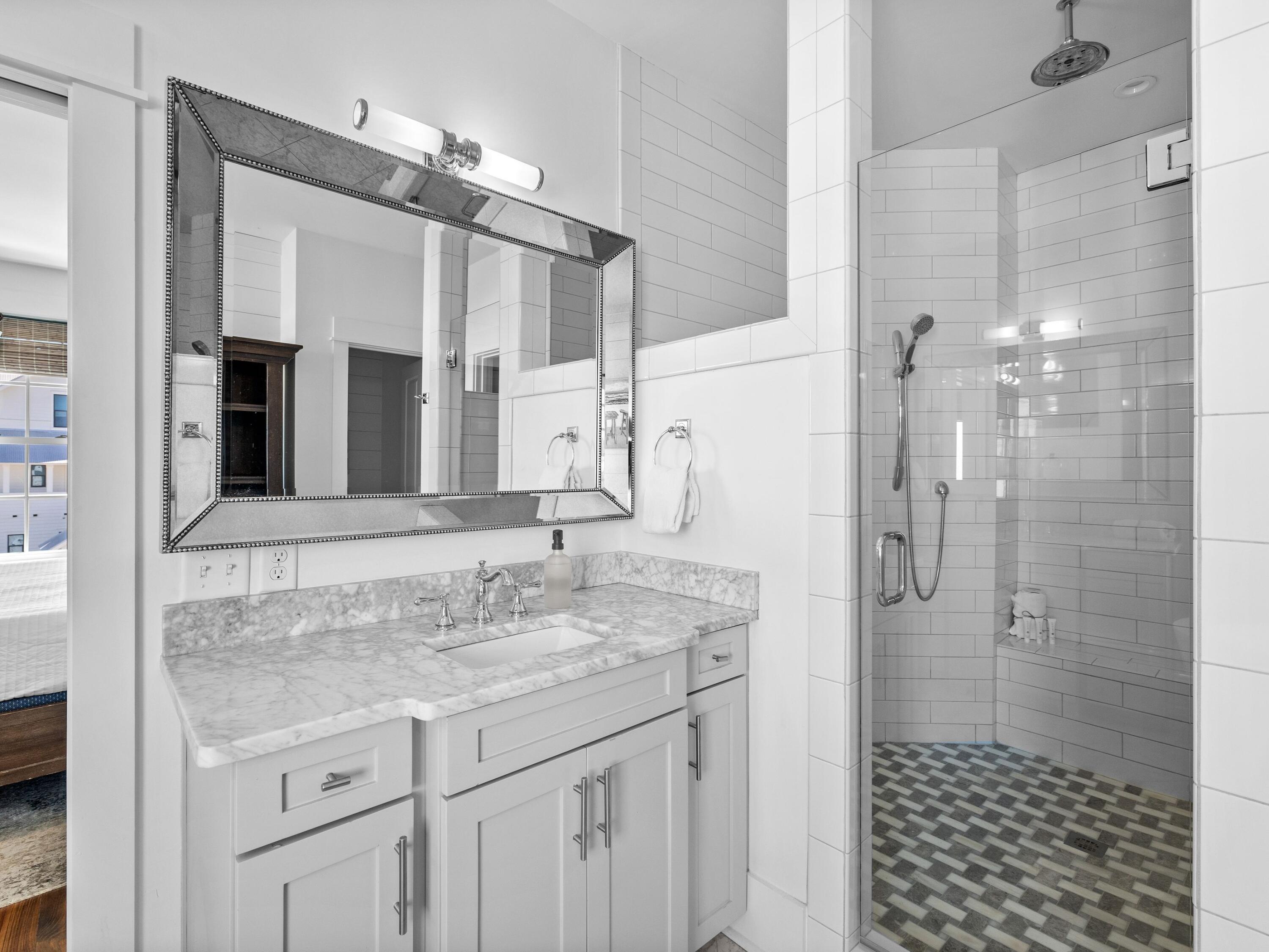 113 Dunes Estates Boulevard Santa Rosa Beach, FL 32459 - Photo 21 of 35 a bathroom with a granite countertop shower sink and mirror