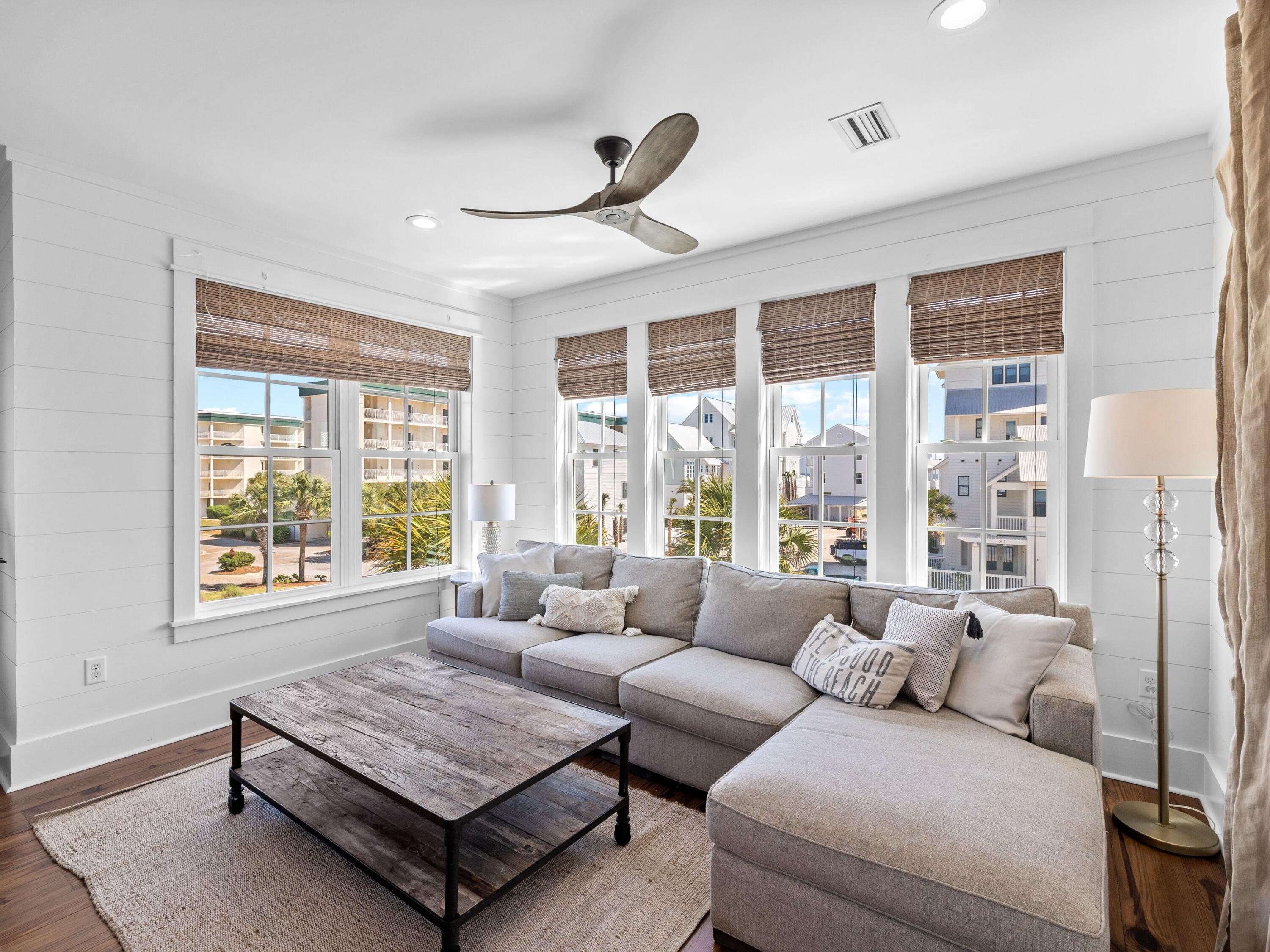 113 Dunes Estates Boulevard Santa Rosa Beach, FL 32459 - Photo 23 of 35 a living room with furniture and a large window