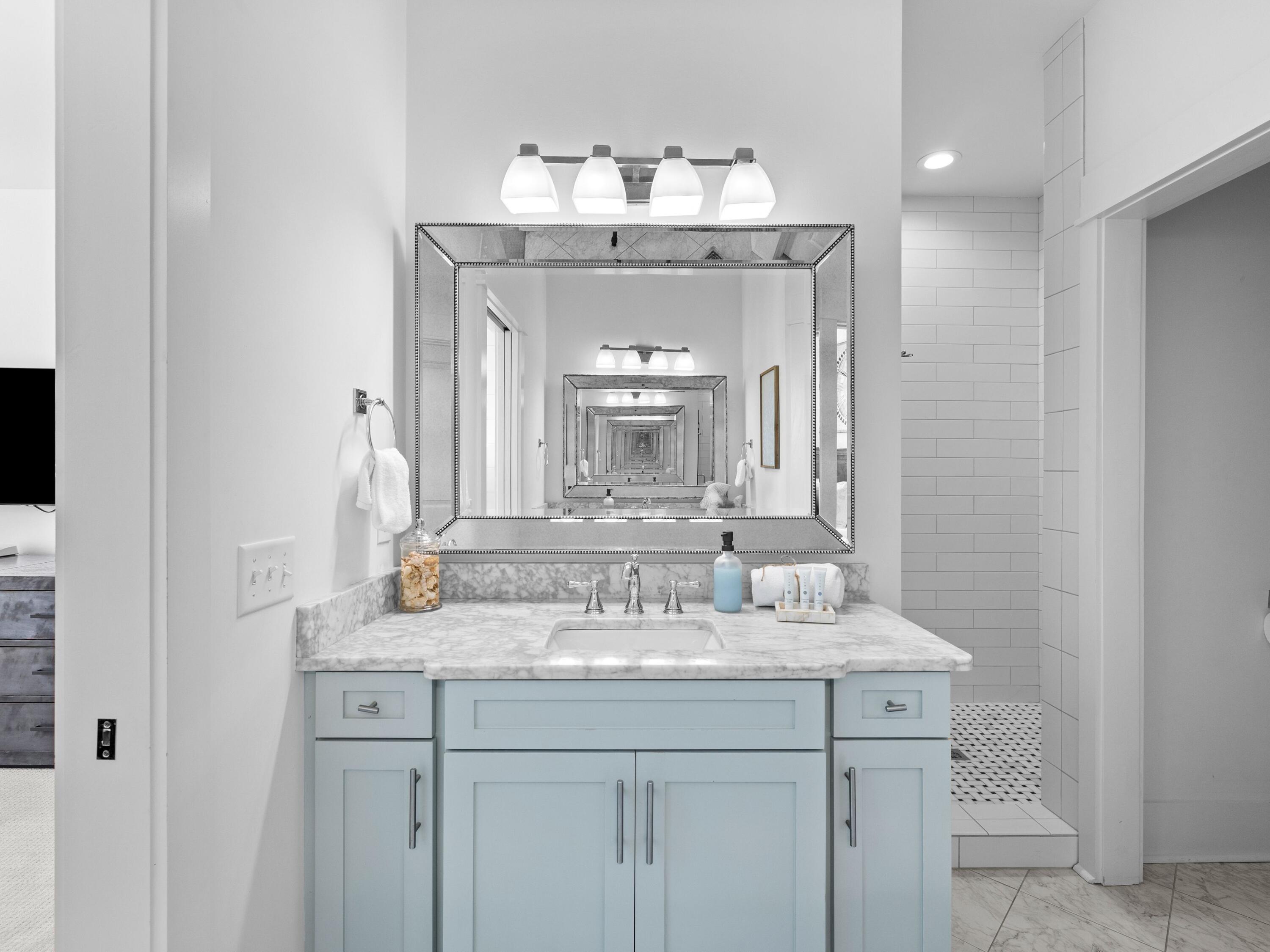 113 Dunes Estates Boulevard Santa Rosa Beach, FL 32459 - Photo 25 of 35 a bathroom with a sink and a mirror