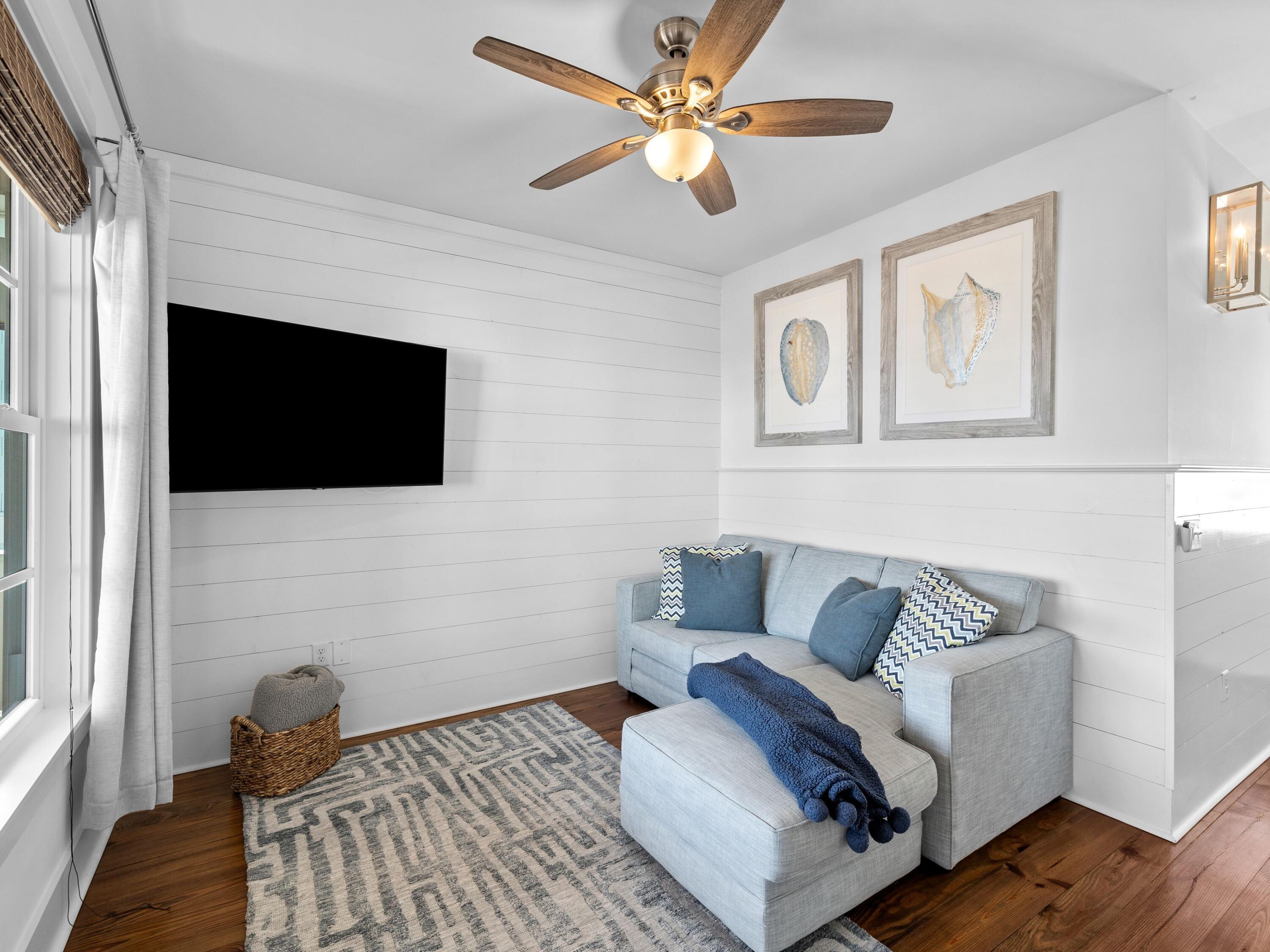 113 Dunes Estates Boulevard Santa Rosa Beach, FL 32459 - Photo 31 of 35 a living room with furniture and a flat screen tv