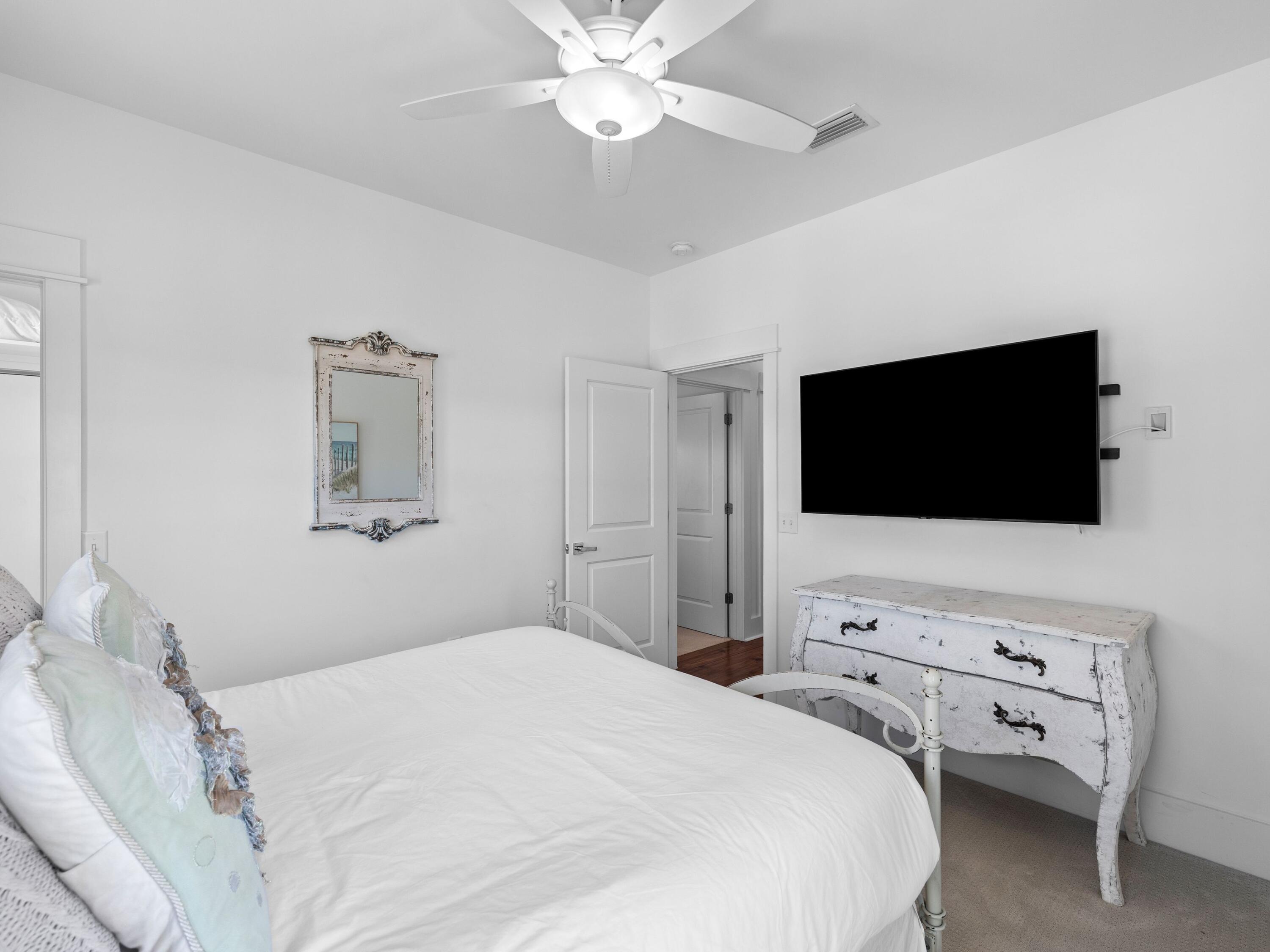 113 Dunes Estates Boulevard Santa Rosa Beach, FL 32459 - Photo 32 of 35 a bedroom with a bed and a flat screen tv