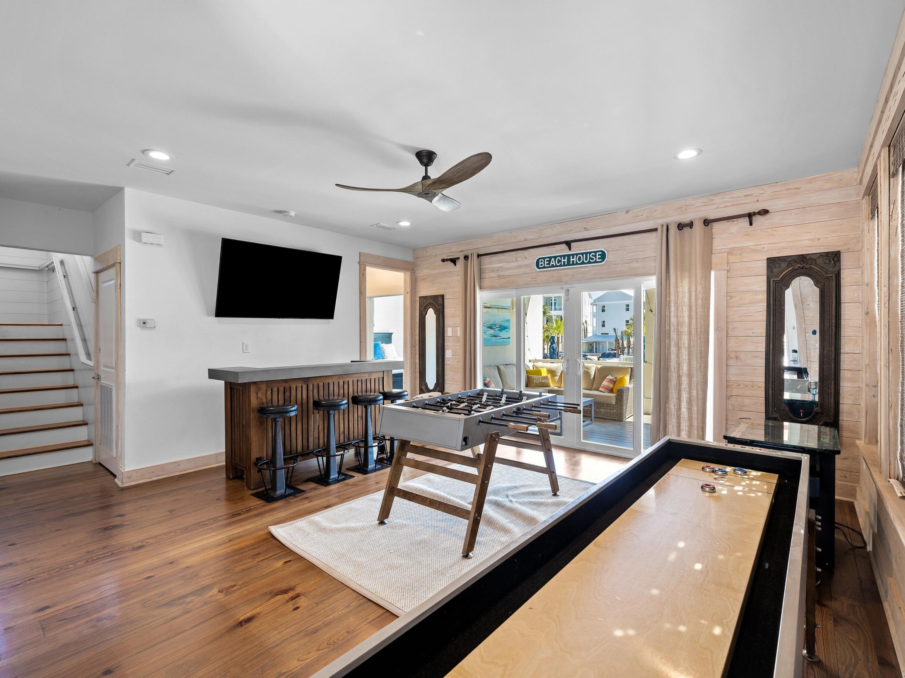 113 Dunes Estates Boulevard Santa Rosa Beach, FL 32459 - Photo 4 of 35 a living room with furniture flat screen tv and a large window
