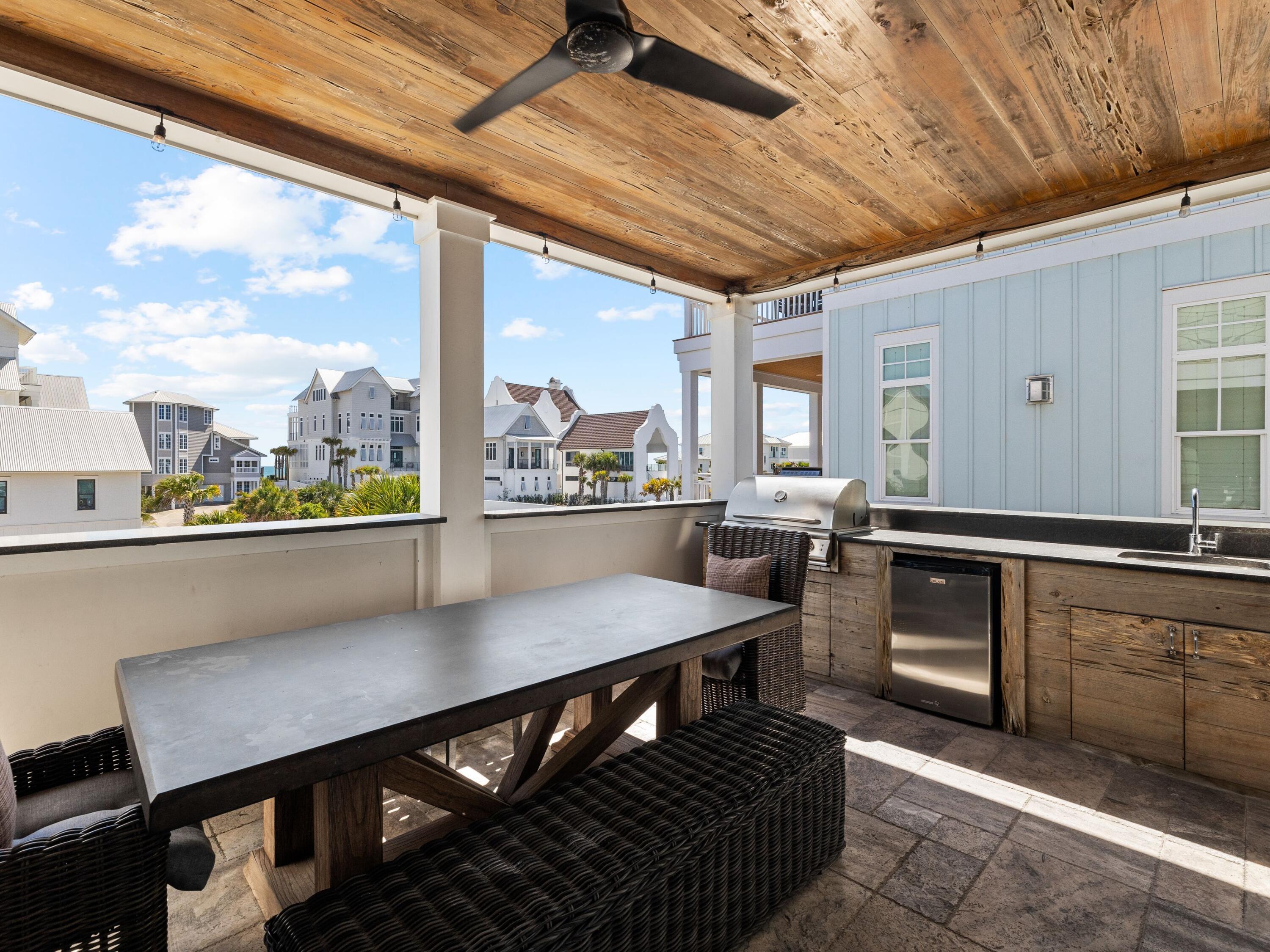 113 Dunes Estates Boulevard Santa Rosa Beach, FL 32459 - Photo 6 of 35 a open kitchen with glass top table and chairs