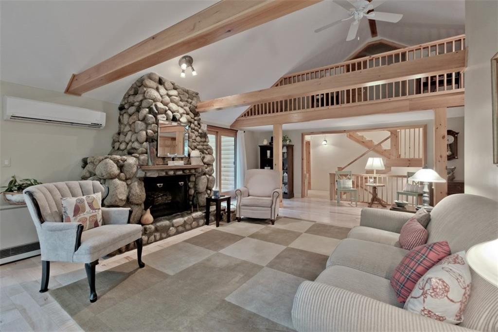 60 Mountain Road Bridgton, ME 04009 - Photo 9 of 35 The living looks up to a balcony off...