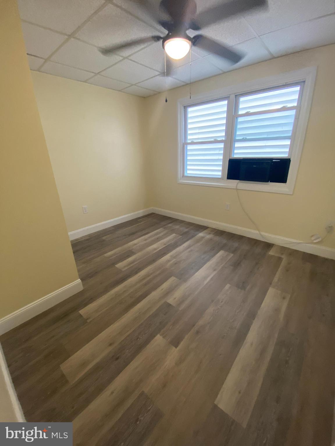 53 Gilmore Street, Unit A Keyser, WV 26726 - Photo 5 of 9 an empty room with a window