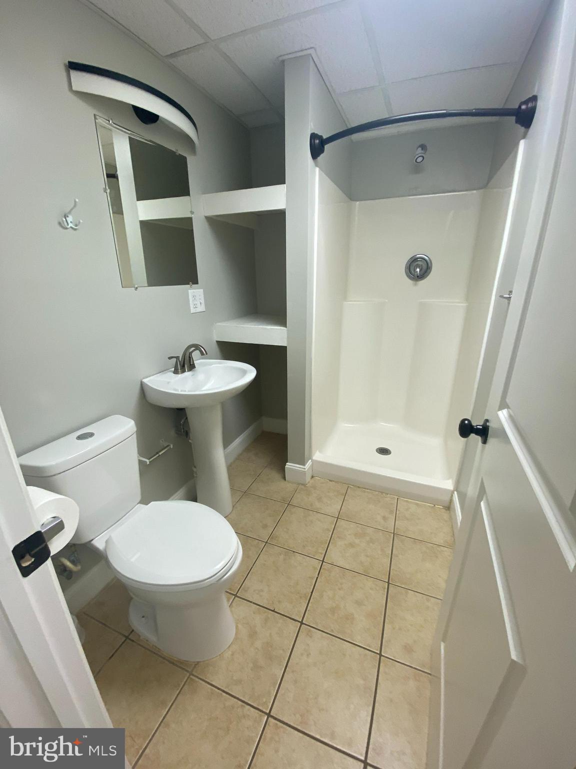 53 Gilmore Street, Unit A Keyser, WV 26726 - Photo 9 of 9 a bathroom with a toilet a sink and shower