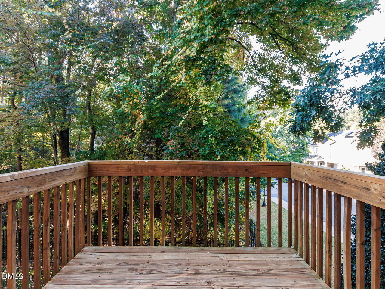 8729 Cypress Grove Run Raleigh, NC 27612 - Photo 9 of 41 a balcony with wooden floor and yard in the back