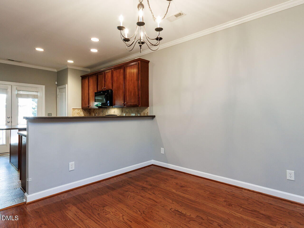 8729 Cypress Grove Run Raleigh, NC 27612 - Photo 10 of 41 wooden floor in an empty room with a window