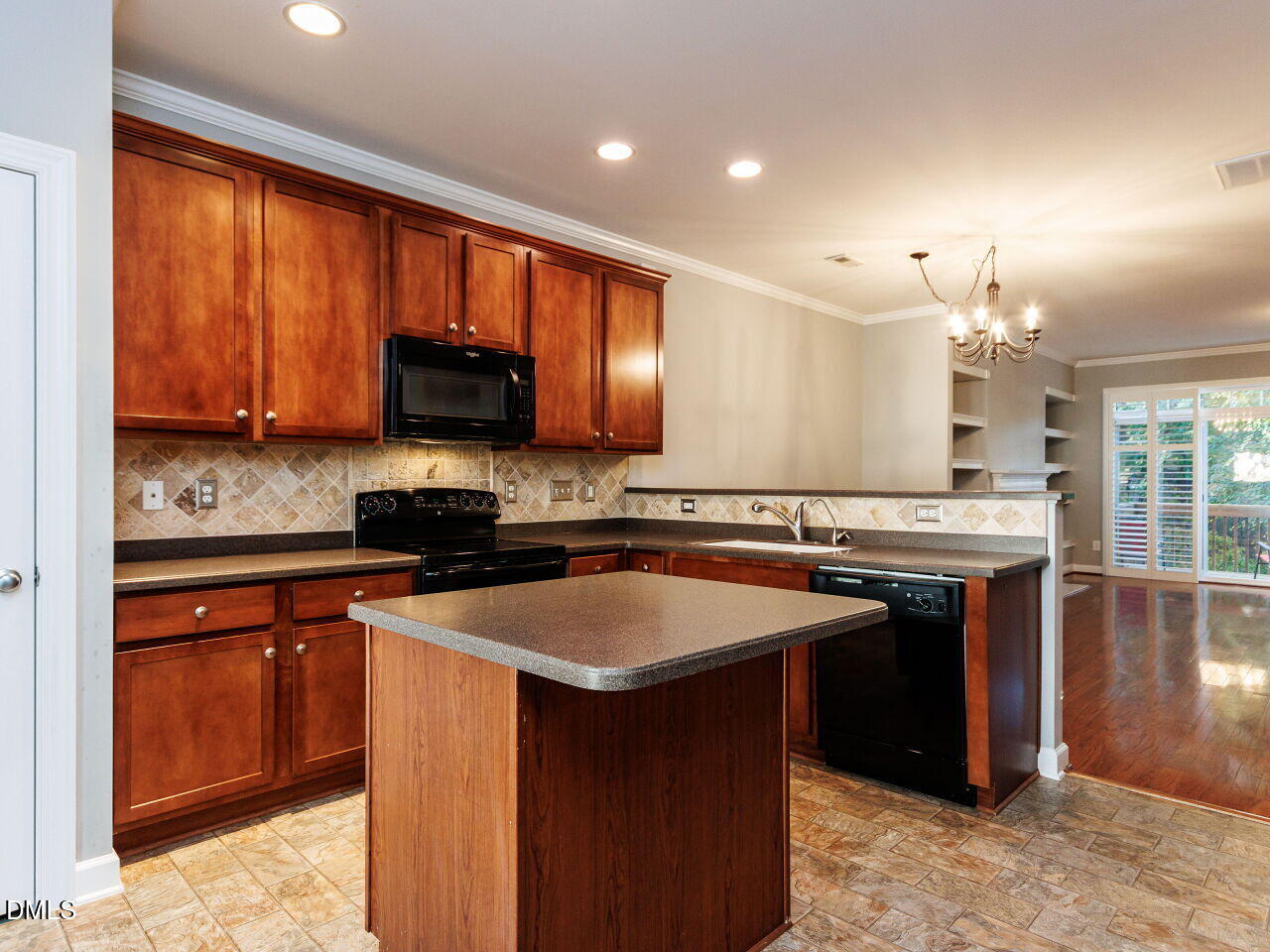 8729 Cypress Grove Run Raleigh, NC 27612 - Photo 13 of 41 a kitchen with stainless steel appliances granite countertop a stove a sink and a microwave