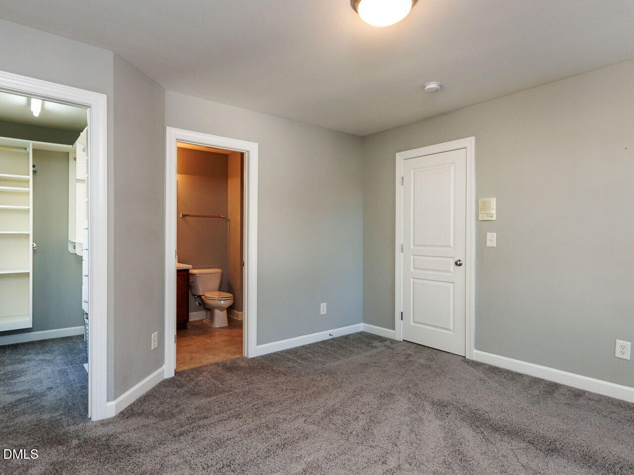 8729 Cypress Grove Run Raleigh, NC 27612 - Photo 18 of 41 an empty room with closet and a bathroom