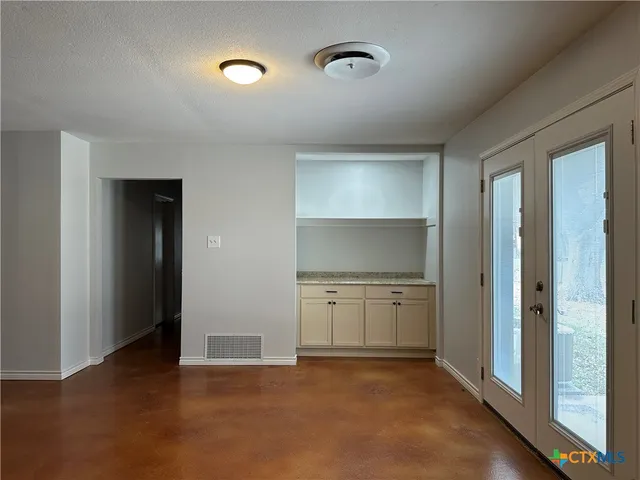 a kitchen with stainless steel appliances a refrigerator and a stove