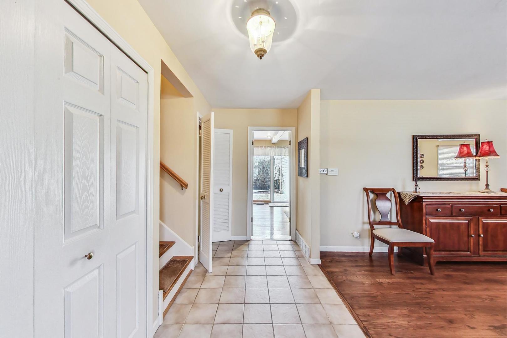 6S271 New Castle Road Naperville, IL 60540 - Photo 2 of 34 a view of room with furniture and a rug