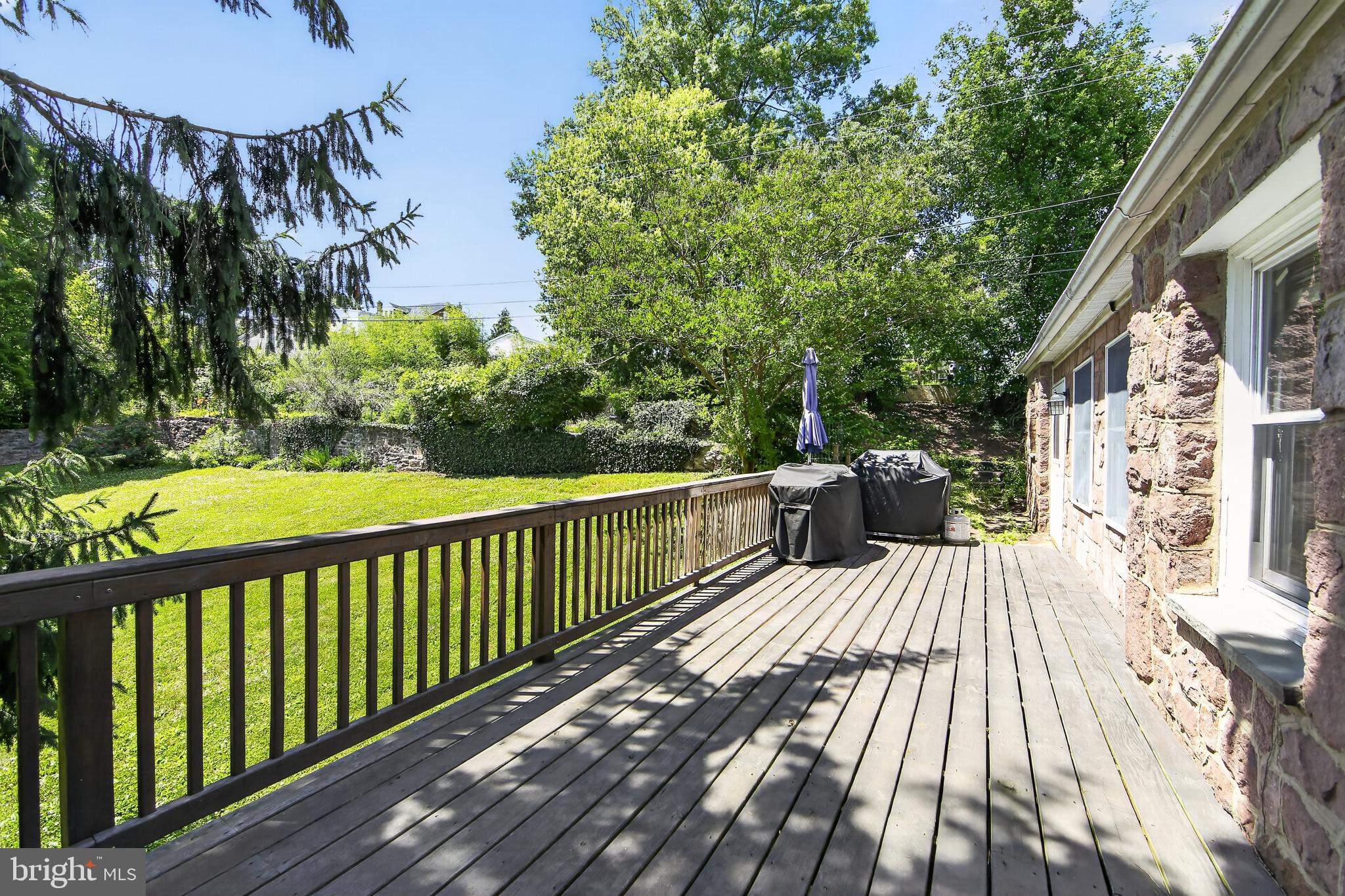238 Brown Street Spring City, PA 19475 - Photo 15 of 57 Sunny deck overlooking lush greenery.