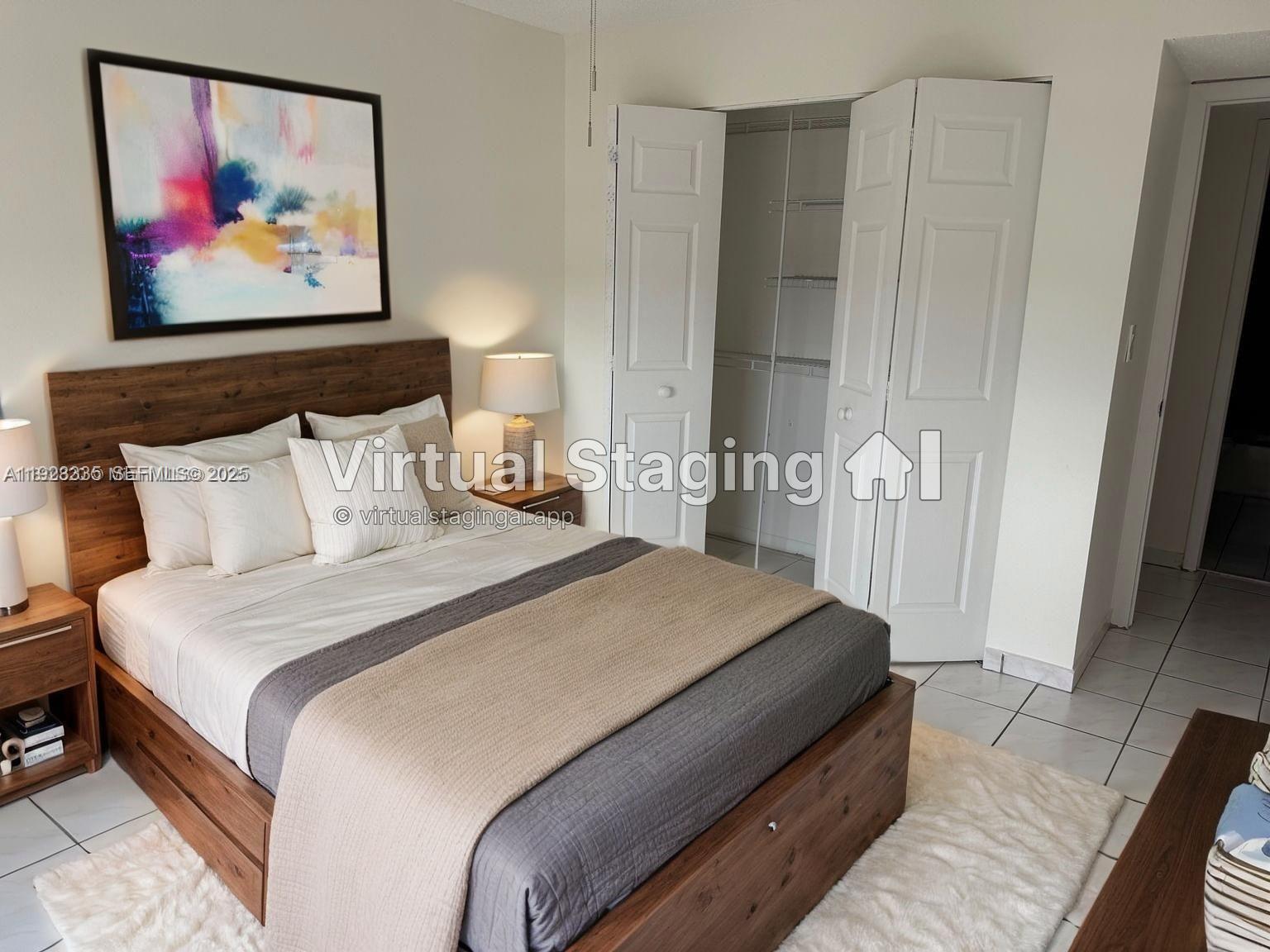 14250 Southwest 62nd Street, Unit 524 Miami, FL 33183 - Photo 12 of 27 a spacious bedroom with bed and wall painting on the wall