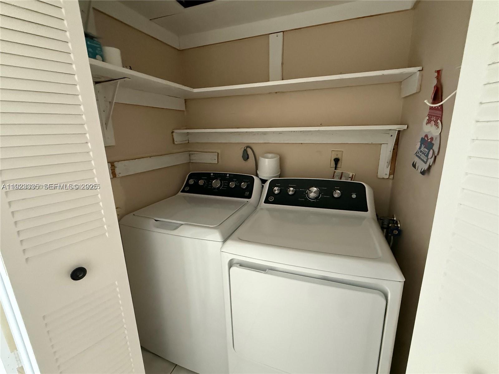 14250 Southwest 62nd Street, Unit 524 Miami, FL 33183 - Photo 14 of 27 a utility room with dryer and washer