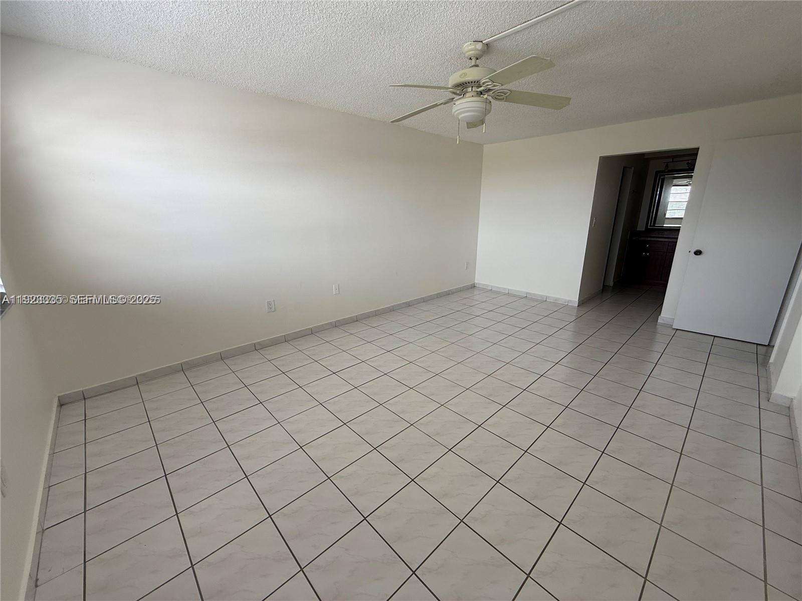 14250 Southwest 62nd Street, Unit 524 Miami, FL 33183 - Photo 15 of 27 an empty room with windows