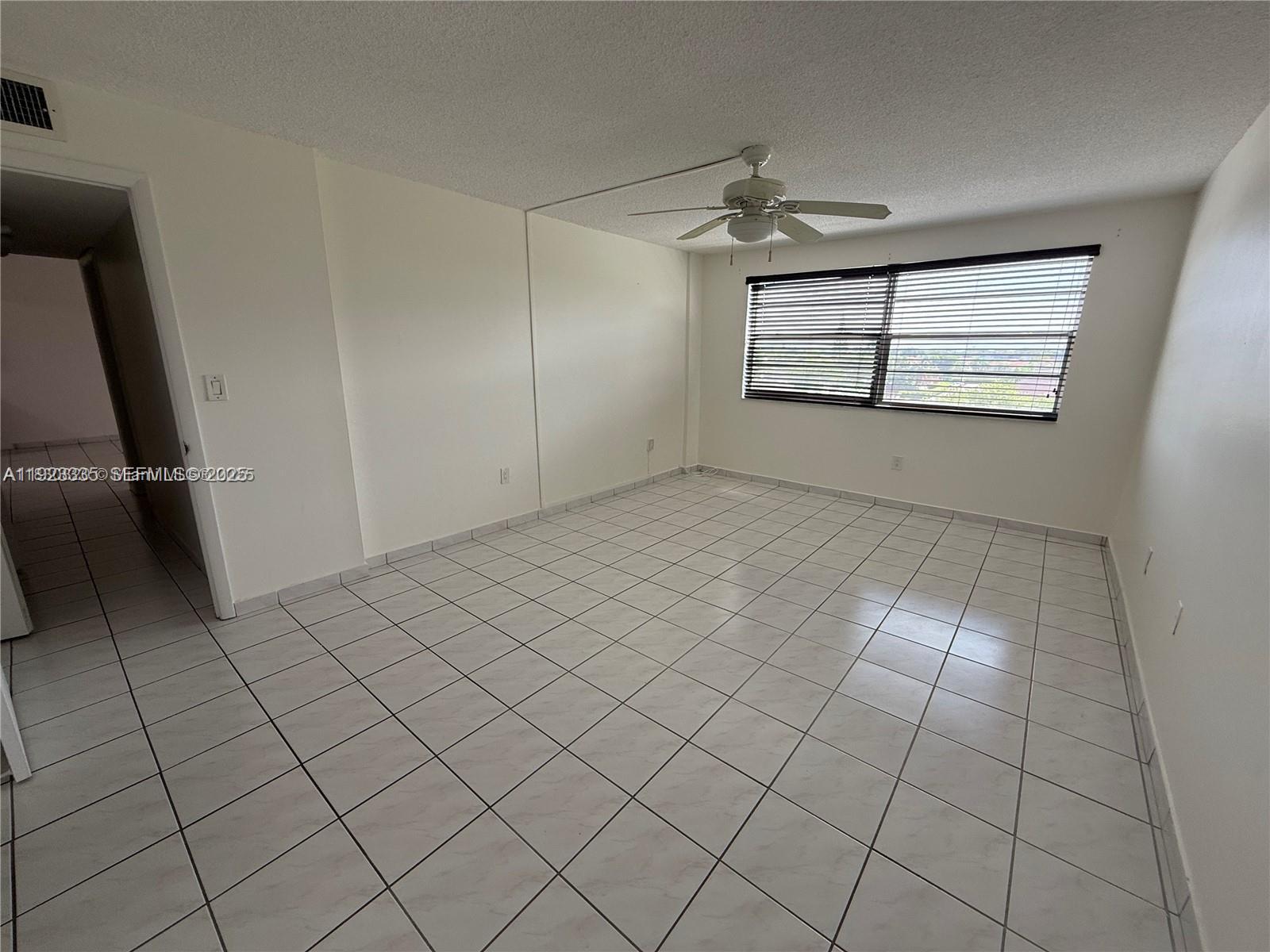 14250 Southwest 62nd Street, Unit 524 Miami, FL 33183 - Photo 17 of 27 an empty room with windows