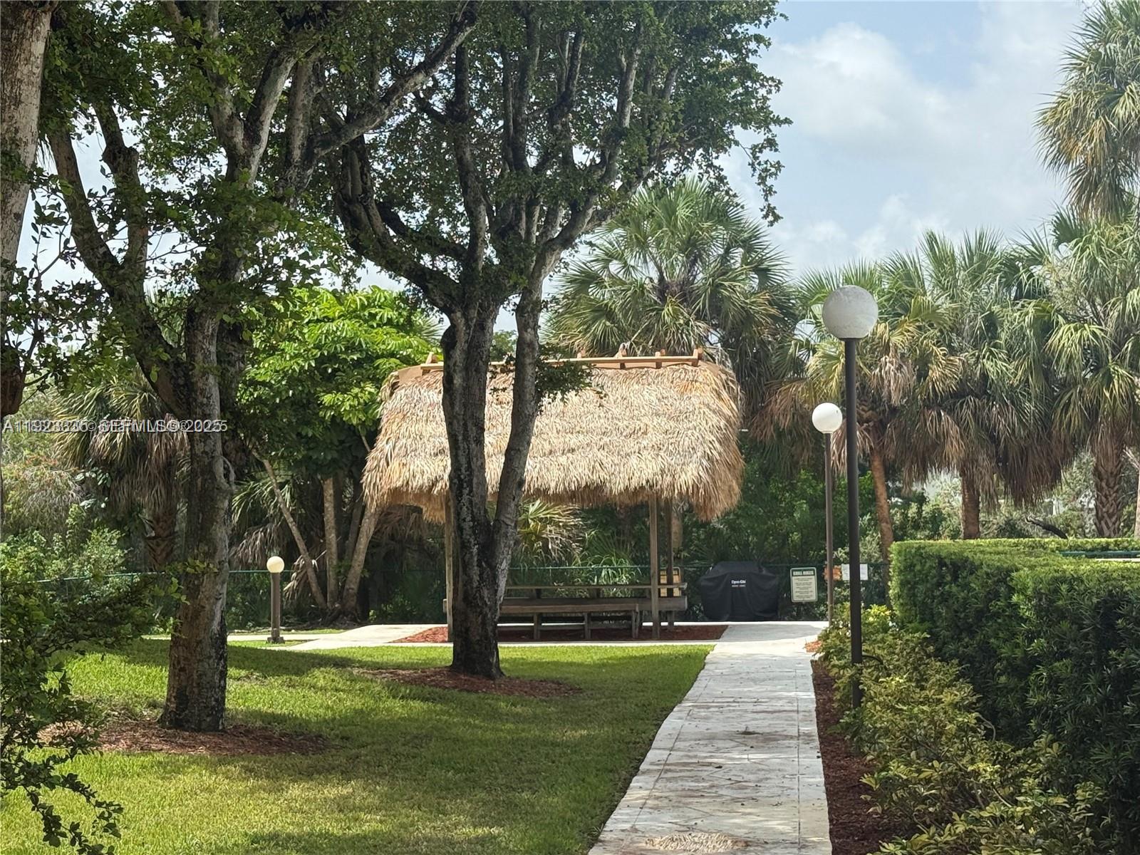 14250 Southwest 62nd Street, Unit 524 Miami, FL 33183 - Photo 26 of 27 a park with large trees