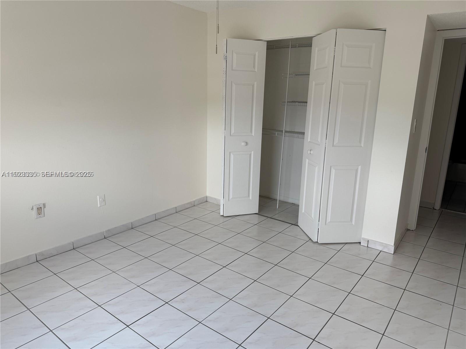 14250 Southwest 62nd Street, Unit 524 Miami, FL 33183 - Photo 10 of 27 an empty room with cabinet