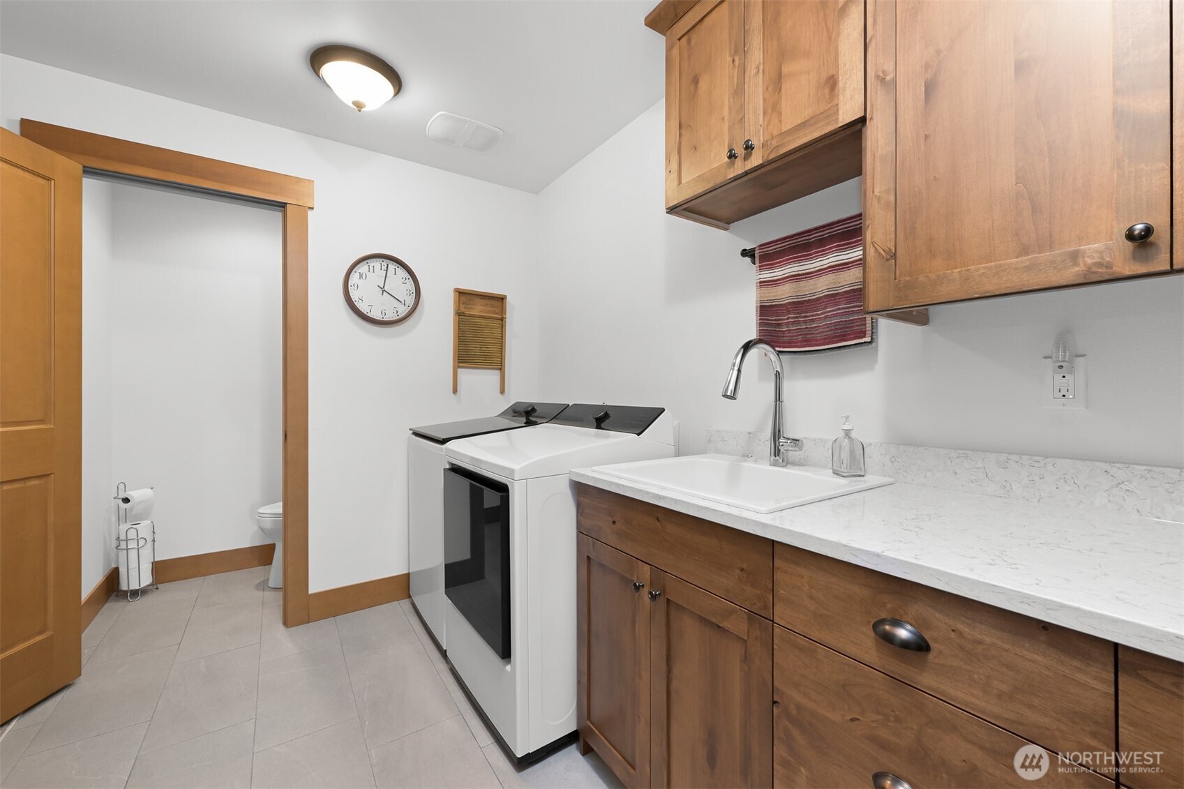 502 Westview Place Nooksack, WA 98276 - Photo 12 of 30 a kitchen with a sink and a refrigerator