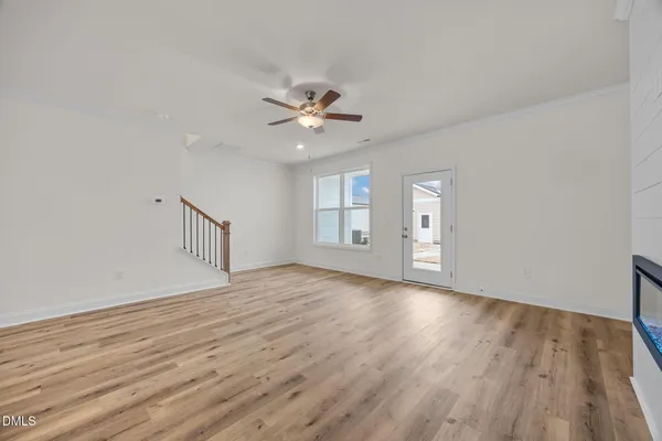 wooden floor in an empty room with a window