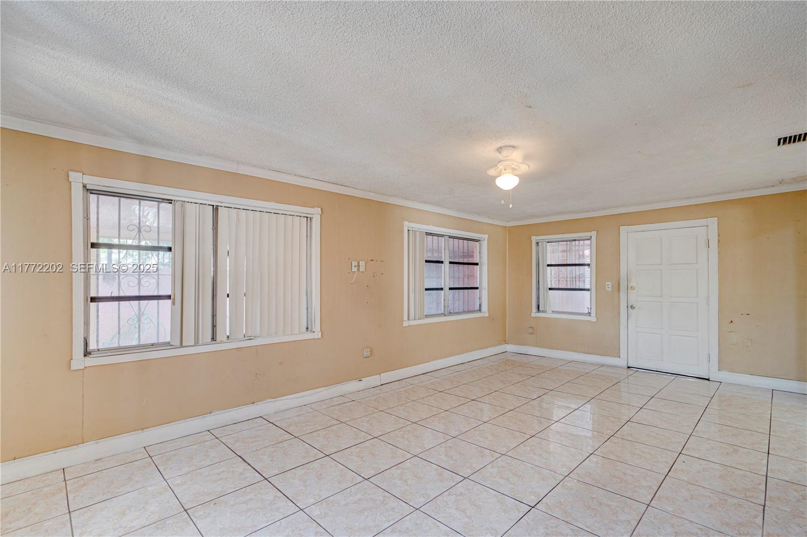 390 East 44th Street Hialeah, FL 33013 - Photo 11 of 39 a view of an empty room with a window