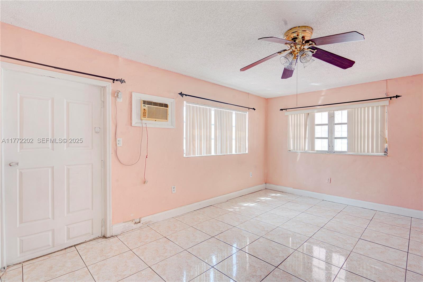 390 East 44th Street Hialeah, FL 33013 - Photo 13 of 39 a view of an empty room with a window
