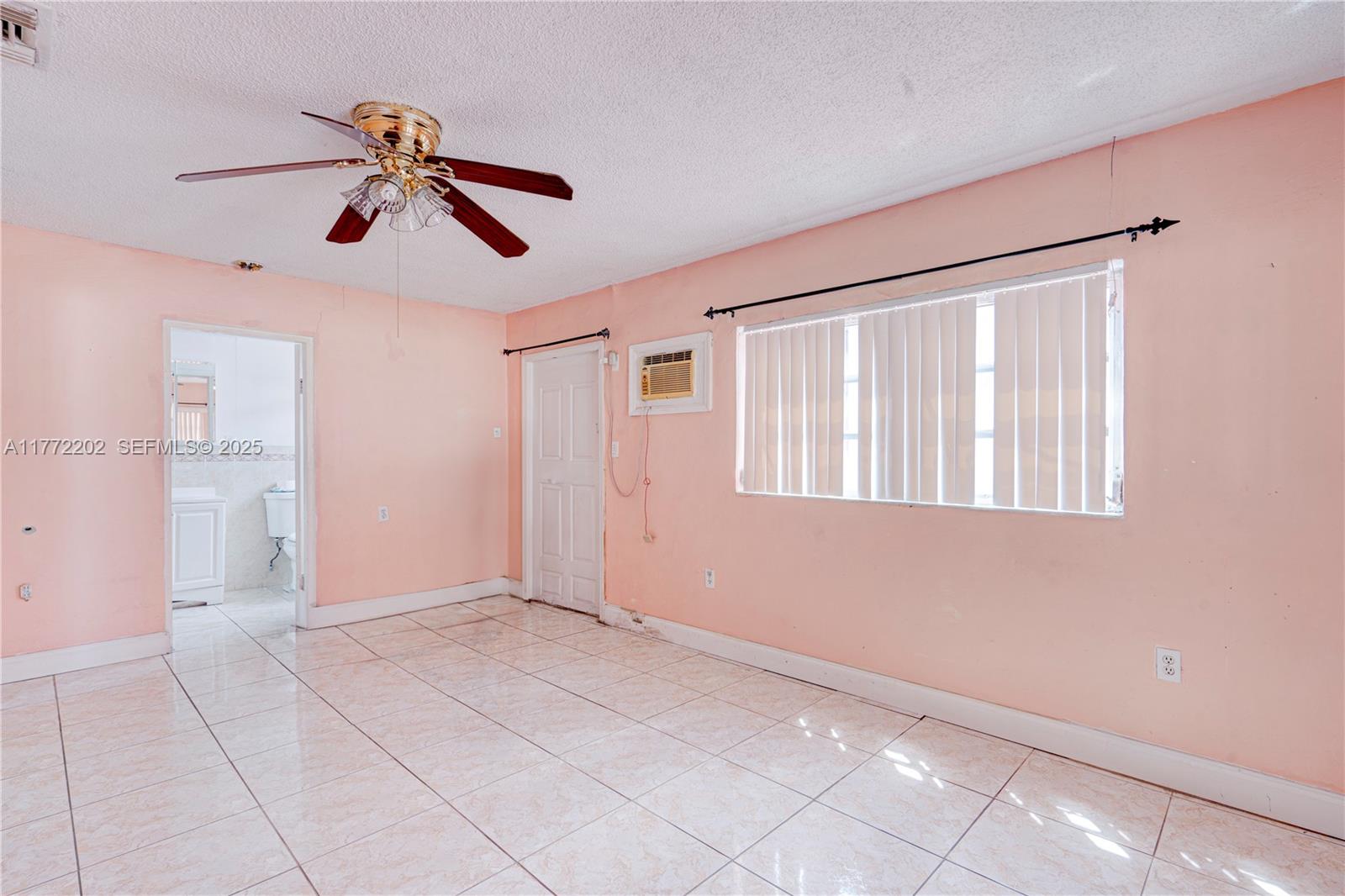390 East 44th Street Hialeah, FL 33013 - Photo 14 of 39 a view of an empty room with a window
