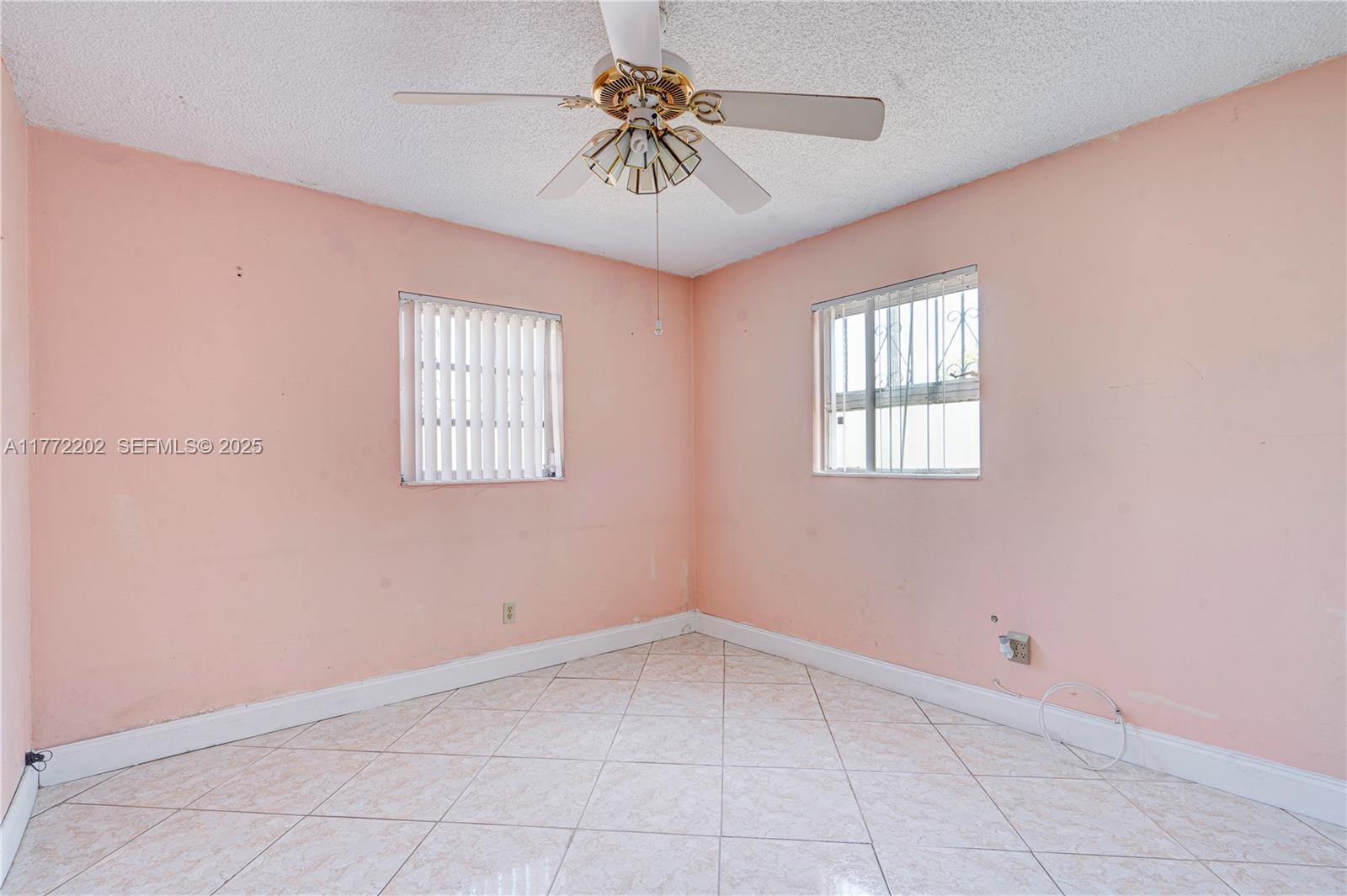390 East 44th Street Hialeah, FL 33013 - Photo 15 of 39 a view of an empty room with a window