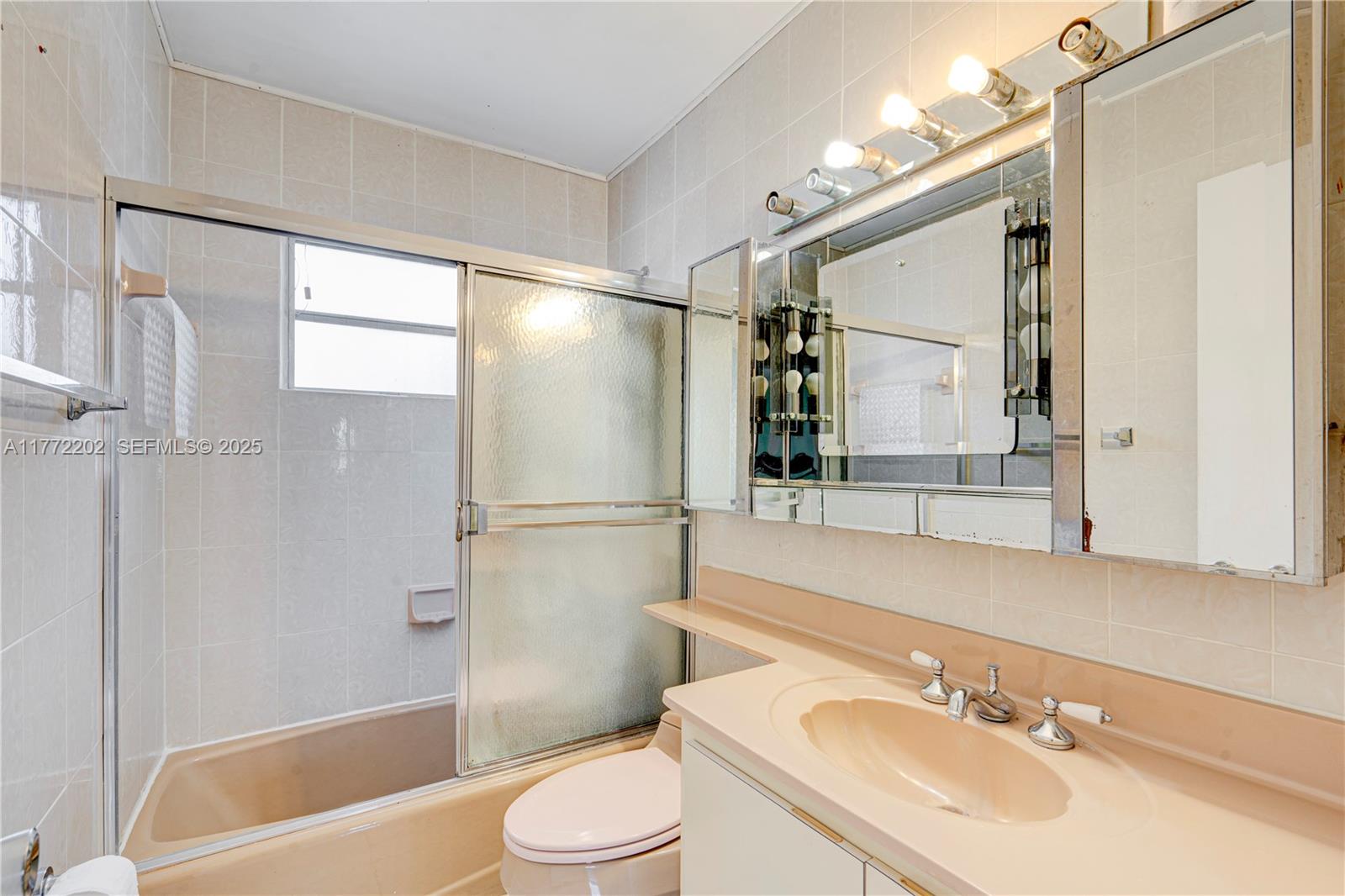 390 East 44th Street Hialeah, FL 33013 - Photo 17 of 39 a bathroom with a sink toilet and shower