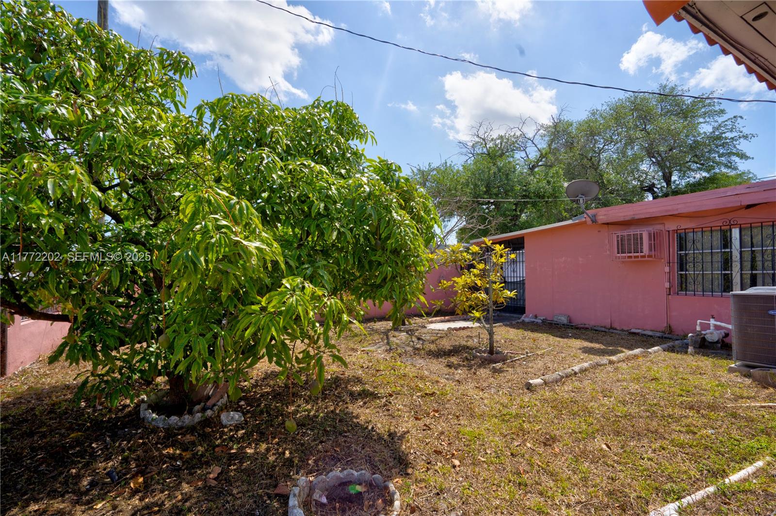 390 East 44th Street Hialeah, FL 33013 - Photo 21 of 39 a backyard of a house with lots of green space