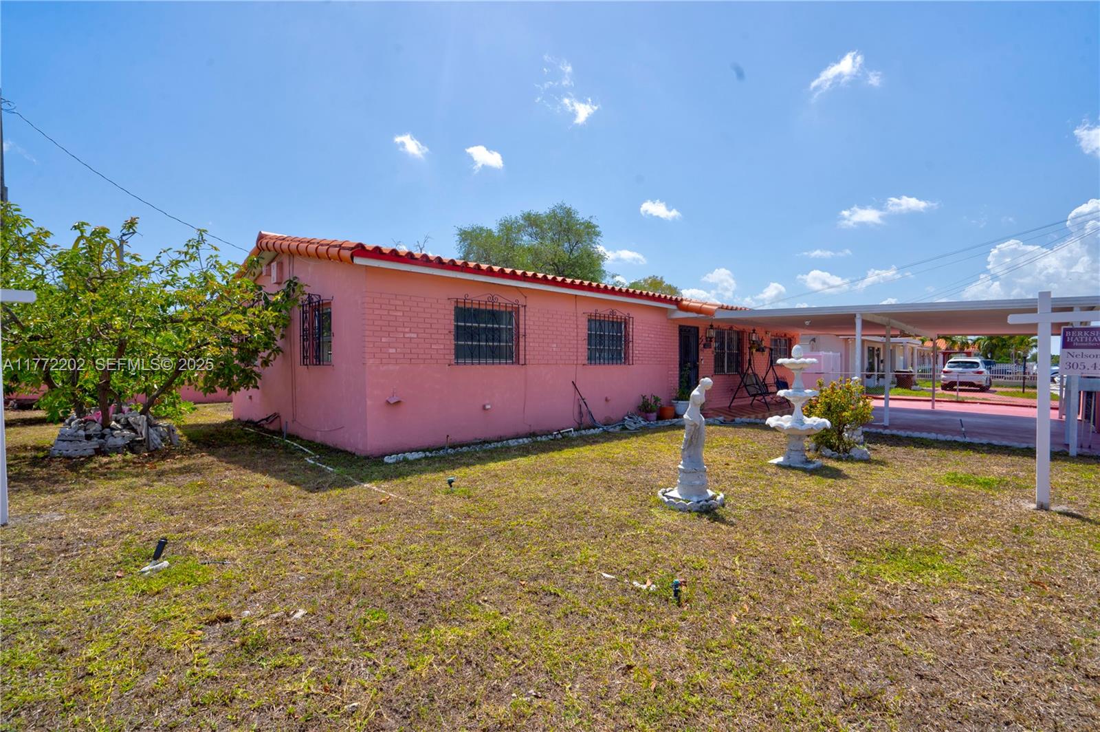 390 East 44th Street Hialeah, FL 33013 - Photo 22 of 39 a backyard of a house with lots of green space