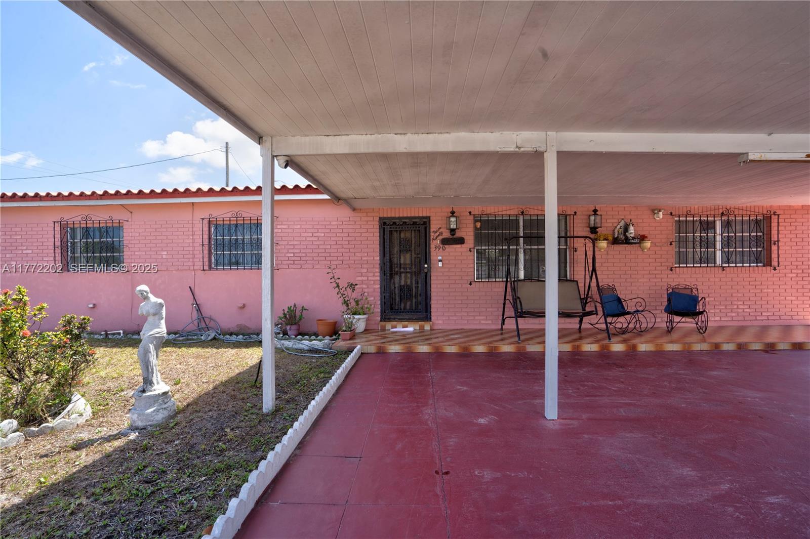 390 East 44th Street Hialeah, FL 33013 - Photo 23 of 39 a backyard of a house with shaded area
