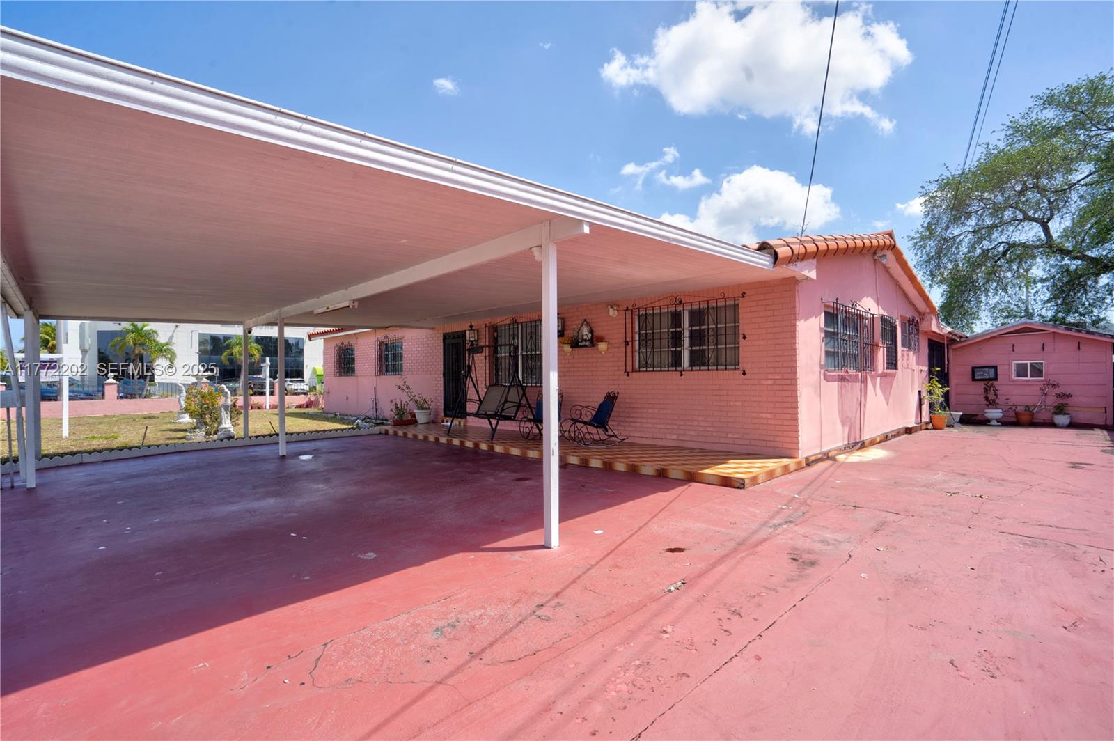 390 East 44th Street Hialeah, FL 33013 - Photo 38 of 39 a view of a house with a patio