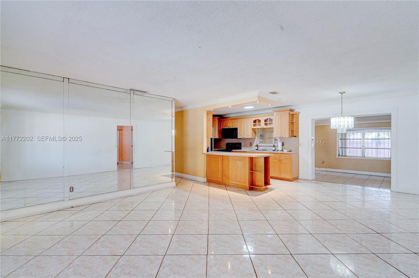 390 East 44th Street Hialeah, FL 33013 - Photo 5 of 39 a large white kitchen with cabinets and a sink