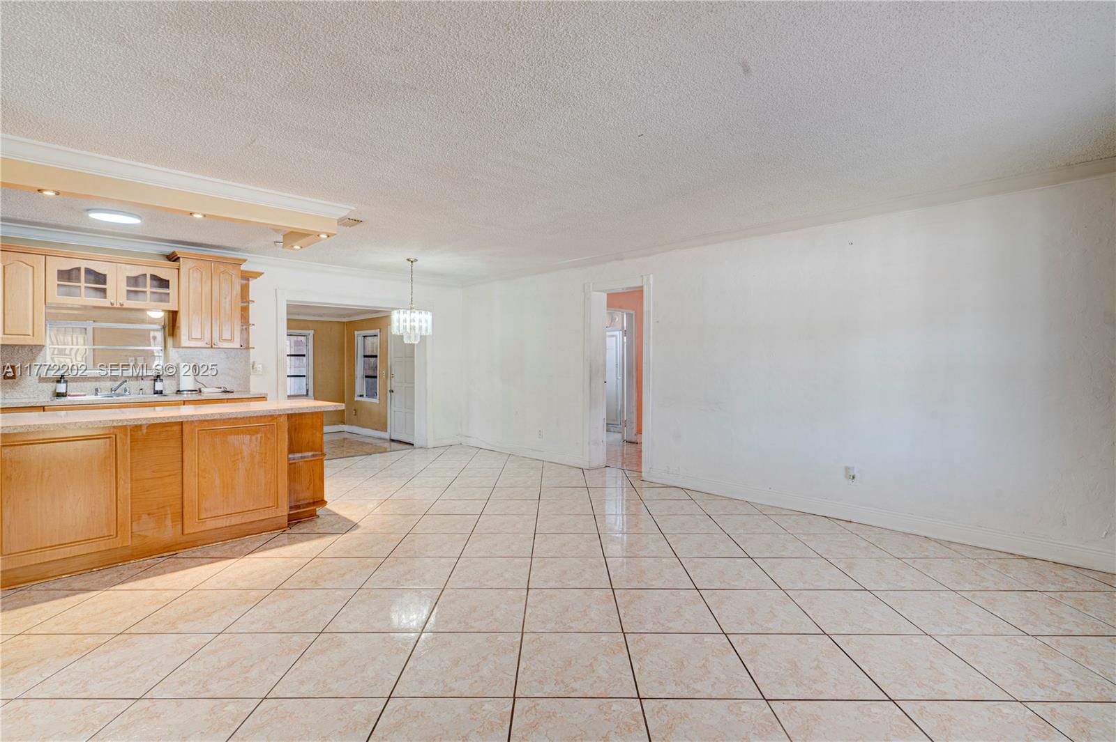 390 East 44th Street Hialeah, FL 33013 - Photo 6 of 39 a large white kitchen with a sink and cabinets